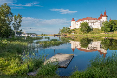Summer evening by Lake Vanern and Lacko Castle in Swedenのeditorial素材