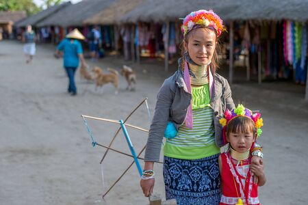 Chiang Rai, Thailand - February 4, 2016: Karen long neck mother and daughter in a village between Chiang Rai and Chiang Mai. Karen is one of several ethnic hill tribes in northern Thailandのeditorial素材