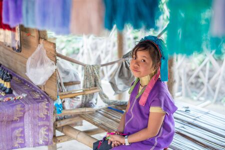 Chiang Rai, Thailand - February 4, 2016: Karen long neck girl in a village between Chiang Rai and Chiang Mai. Karen is one of several ethnic hill tribes in northern Thailandのeditorial素材