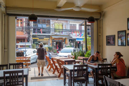 Vientiane, Laos - February 8, 2017: Street scene viewed from a restaurant in Vientiane.  The capital of Laos is comparatively small with a population of approximately half a million.のeditorial素材