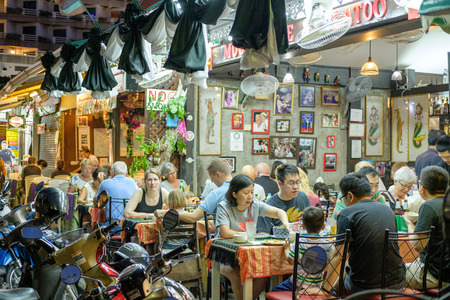 Hua Hin, Thailand - January 31, 2017: Thai restaurant in Hua Hin with mourning ribbons in honor of  King Bhumibol Adulyadej. Signs of remembrance of the king are visible all over the country.のeditorial素材