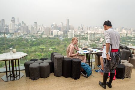 Bangkok, Thailand - February 24, 2016: Roof top bar overlooking Lumpini park in Bangkok. Roof top bars are a major tourist attraction in Bangkok.のeditorial素材