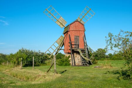 Traditional windmill on Swedish island Oland in the Baltic Sea. Windmills are a common sight on Oland, which is nicknamed the island of the sun and winds.の写真素材