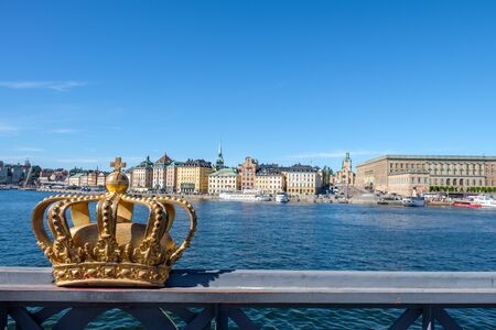 Stockholm, Sweden - July 6, 2017: View towards historic Old Town in Stockholm from Skeppsholmen bridge with its golden Royal crown. The capital city of Sweden is built on 17 islands.のeditorial素材