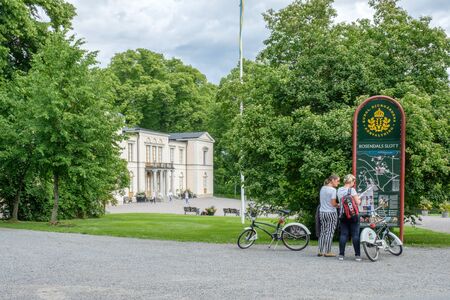 Stockholm, Sweden - July 5, 2017: Tourists with bicycles at Rosendal palace in Stockholm. Rosendal palace located in the recreational area of Djurgarden is one of 11 Royal palaces in Sweden.のeditorial素材