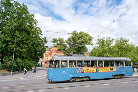 Stockholm, Sweden - July 5, 2017: Vintage blue tram serving Djurgarden in Stockholm. Djurgarden is a recreational area with historical buildings, monuments, amusement park and open-air museum.のeditorial素材