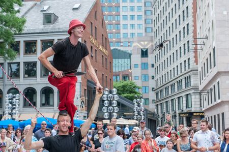 Boston, USA - June 23, 2010: Street artists entertaining tourists outside Quincy Market in Boston, Massachusetts. The market is a historic place constructed in 1824 â 1826.のeditorial素材