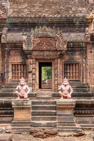 Banteay Srei, a 10th century Hindu temple dedicated to Shiva. The temple built in red sandstone was forgotten for centuries and rediscovered 1814 in the jungle of the Angkor area of Cambodia.のeditorial素材
