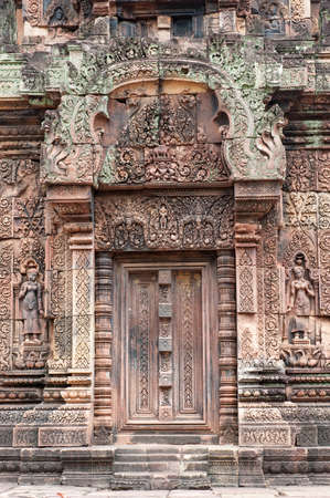 Architectural detail at Banteay Srei, a 10th century Hindu temple dedicated to Shiva. The temple was forgotten for centuries and rediscovered 1814 in the jungle of the Angkor area of Cambodia.の写真素材