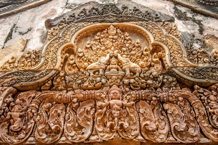Architectural detail at Banteay Srei, a 10th century Hindu temple dedicated to Shiva. The temple was forgotten for centuries and rediscovered 1814 in the jungle of the Angkor area of Cambodia.のeditorial素材