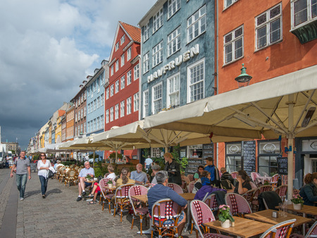 Copenhagen, Denmark - August 21, 2013: Restaurant at Nyhavn, a 17th century harbor district in the center of Copenhagen and currently a popular waterfront tourist attraction and entertainment district.のeditorial素材