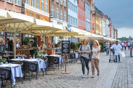 Copenhagen, Denmark - August 21, 2013: Restaurant at Nyhavn, a 17th century harbor district in the...