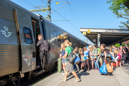 Norrkoping, Sweden - May 13, 2018: High-speed inter-city train between Stockholm and Copenhagen stopping at Norrkoping Central Station.のeditorial素材