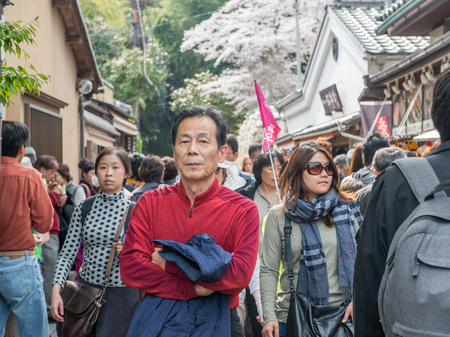 Arashiyama, Japan - April 4, 2013: Japanese tourists explore Arashiyama in the outskirts of Kyoto, Japan. Arashiyama has been a popular destination during cherry blossom since the 8th century.のeditorial素材