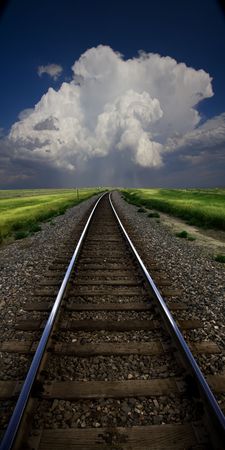Tracks lead to storm cloudの写真素材