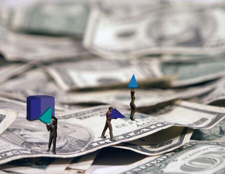 Business people walk away with their piece of the pieの写真素材