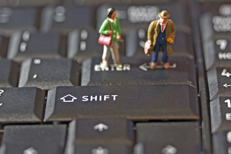 Two Figures on Keyboardの写真素材