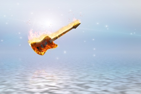 Burning bass guitar over clean pure oceanの写真素材