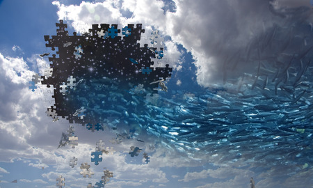 Fish swin into hole in the skyの写真素材