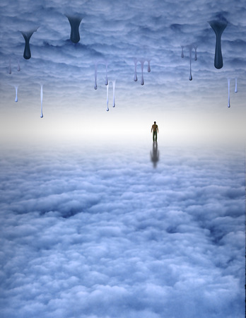 Man in space of light slowly meltingの写真素材