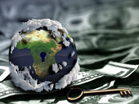 Globe with keyhole and key on US dollars.の写真素材