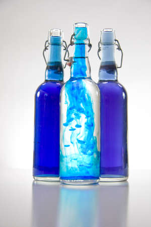 Blue substance in glass bottlesの写真素材