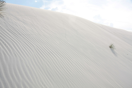 Clouds over surreal white desertの写真素材