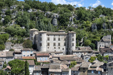 France, Auvergne-Rhone-Alpes, Vogue, river Ardeche: Skyline scenic panoramic view with famous ancient stone castle and homes of the French medieval small town with blue sky - concept history travelのeditorial素材