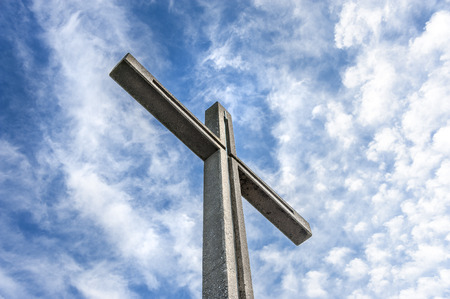 Christian summit cross with blue cloudy sky in the background - concept religion christiantity belief god sign christ symbol. June 06, 2015の写真素材