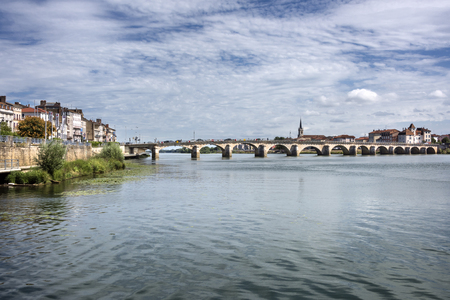 France, Saone-et-Loire, Macon: Panoramic view with famous bridge over Saone river (Pont Saint-Laurent) in the city center of the French town with blue cloudy sky in the background. August 05, 2017のeditorial素材