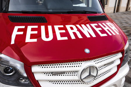 Austria, Vienna, Hofburg Palace: Front view of red white Daimler Mercedes Benz Sprinter fire engine...