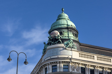 Austria, Vienna, Albertinaplatz: Roof top above old house with statue of Generali insurance company in the city center of the Austrian capital with blue sky - concept architecture. February 01, 2019のeditorial素材