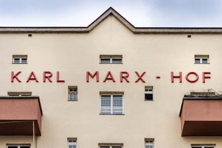 Austria, Vienna, Karl Marx-Hof: Detail front view of famous municipal tenement complex Karl Marx Court with text - concept architecture landmark facade apartment building house history  Feb 04, 2019のeditorial素材