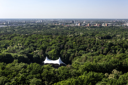 Germany, Berlin, near Olypmpiastadium: Tent and green trees of famous Waldbuhne (Woodland Stage or Forest Stage) in the German capital. May 14, 2018のeditorial素材