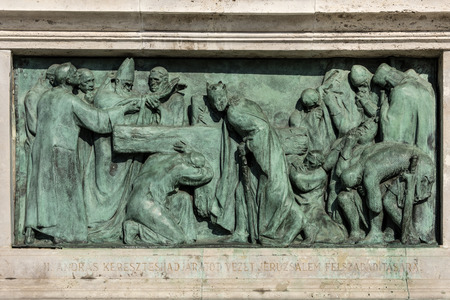 Hungary, Budapest, Hosok tere: Plate with religious Christian scene as part of lthe eft colonnade at famous Heroes' Square in the city center of the Hungarian capital with blue sky - concept religionのeditorial素材