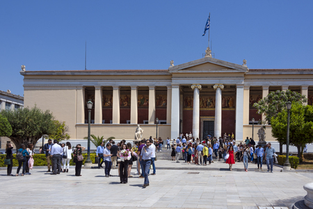 Greece, Athens: Crowd of people students men women in front of famous main building of UoA National and Kapodistrian University of Athens in the city center of the Greek capital. April 24, 2018のeditorial素材