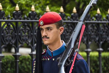 Greece, Athens: Single male member of the Presidential Guard soldier (Evzones or Evzonoi) in the city center of the Greek capital - concept history tradition ceremony elite military. April 30, 2018のeditorial素材
