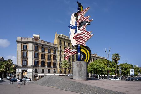 Spain, Barcelona: Street scene with famous surrealist sculpture El Cap de Barcelona by American Pop artist Roy Lichtenstein in the city center of the Spanish town with blue sky. July 01, 2018のeditorial素材