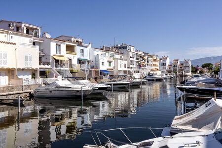 Spain, Catalonia, Costa Brava, Empuriabrava: Skyline panorama view with yachts, boats, waterways, blue sky. The Spanish tourist destination has the largest residential marina in Europe. June 29, 2018のeditorial素材