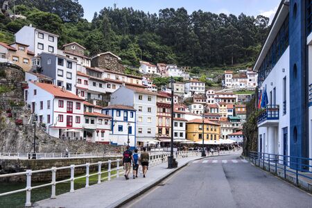 Spain, Asturias, Cudillero, Cuideiru: Fish restaurants people tourists and colorful traditional houses in the city center of Spanish village. Legend says it was founded by the Vikings. July 15, 2018のeditorial素材