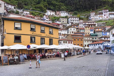 Spain, Asturias, Cudillero, Cuideiru: Fish restaurants people tourists and colorful traditional houses in the city center of Spanish village. Legend says it was founded by the Vikings. July 15, 2018のeditorial素材