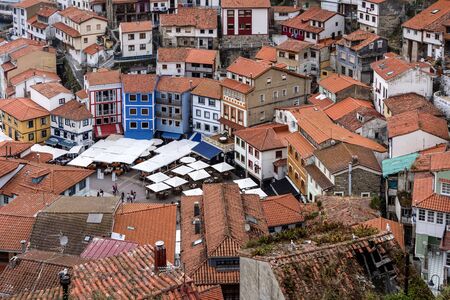 Spain, Asturias, Cudillero, Cuideiru: Colorful traditional houses with red roof tops in the city center of the small Spanish village. Legend says it was founded by the Vikings. July 15, 2018のeditorial素材