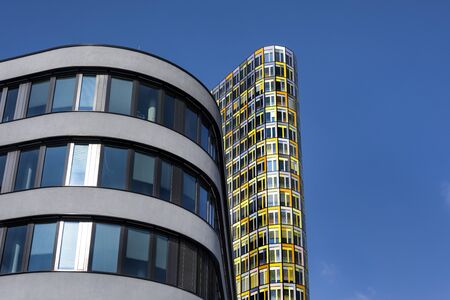 Germany, Bavaria, Munich: Detail side view of German automobile club ADAC headquarters building in the German city center of the Bavarian capital with blue sky in the background. February 28, 2018のeditorial素材