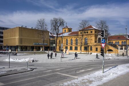 Germany, Bavaria, Munich, Koenigsplatz: Street scene with main entrance of famous Lehnbachhaus, people, white snow and blue sky in the city center of the Bavarian capital at winter. March 01, 2018のeditorial素材