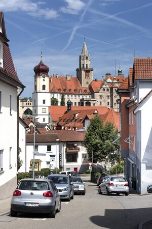 Germany, Sigmaringen, upper Danube - July 31: Street scene with old Hohenzollern castle, parish church St. John, houses, cars and blue sky in the background, July 31, 2017のeditorial素材
