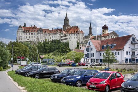 Germany, Sigmaringen, upper Danube - July 31: Panoramic view of ancient Hohenzollern castle which overlooks the old city with  blue sky in the background, July 31, 2017のeditorial素材