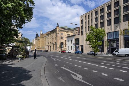 Germany, Berlin, Wedding, Moabit: Street scene with famous old renovated Schulheiss building quartier and blue cloudy sky in the German capital - concept architecture city planning. May 01, 2019のeditorial素材