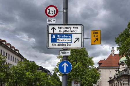 Germany, Munich: A couple of traffic signs on a lamp post in the city center of the Bavarian capital...