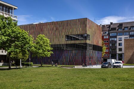 Germany, Munich: Famous colorful facade of Brandhorst Museum colletion in the city center of the Bavarian capital with public park, green grass and blue cloudy sky in the background. May 09, 2019のeditorial素材