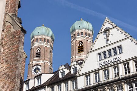 Germany, Bavaria, Munich: The two steeples of the Church of Our Lady (Frauenkirche) and blue sky in the city center of the Bavarian capital. April 22, 2016のeditorial素材